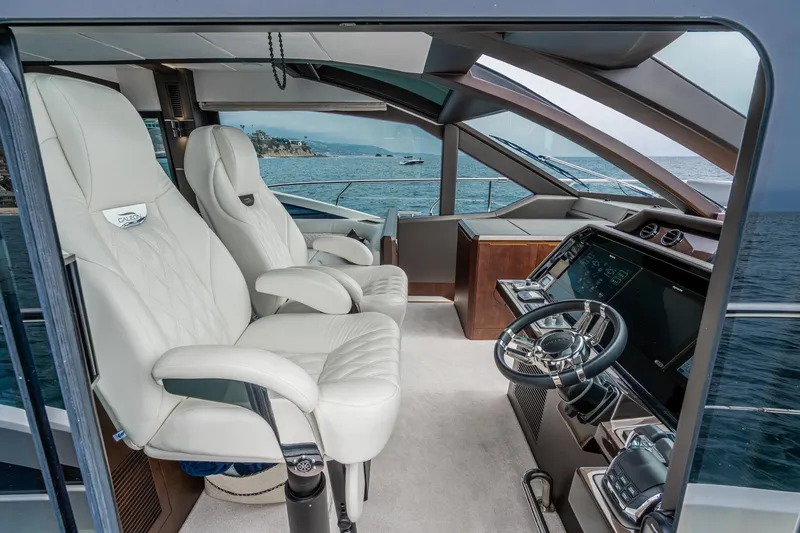 Slide: The Image of Luxurious interior of 2023 Galeon 640 Fly yacht with modern helm and plush seating. - 29