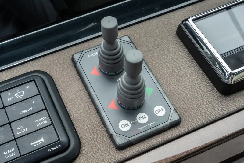 Slide: The Image of Control panel of 2023 Galeon 640 Fly yacht with joysticks and buttons. - 32