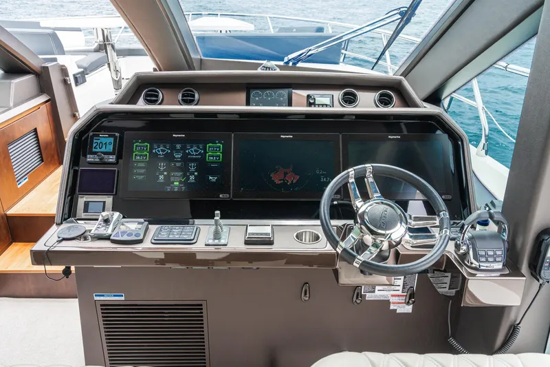 Slide: The Image of 2023 Galeon 640 Fly yacht helm with advanced navigation displays and controls. - 33