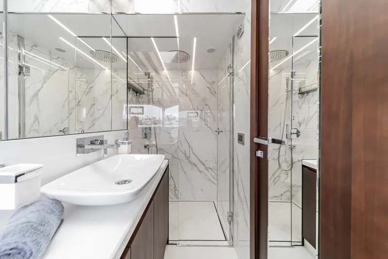 Slide: The Image of Luxurious bathroom in 2023 Galeon 640 Fly yacht with marble walls and modern fixtures. - 36