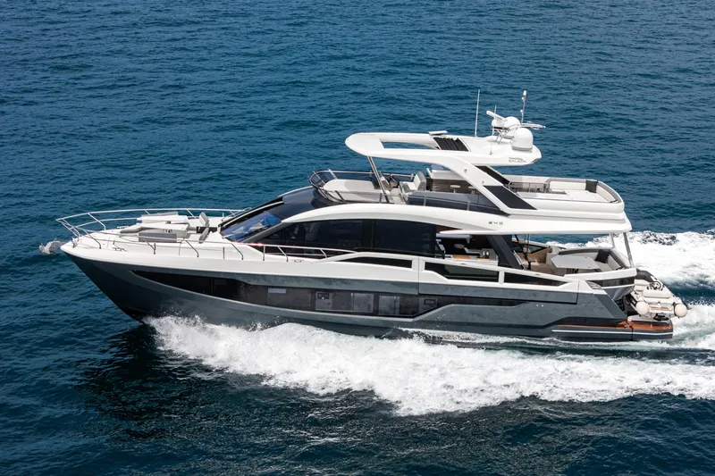 Slide: The Image of 2023 Galeon 640 Fly yacht cruising on open sea, showcasing sleek design and luxury features. - 4