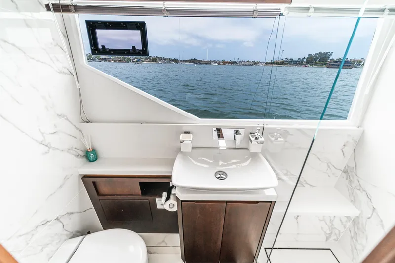 Slide: The Image of Luxurious bathroom on 2023 Galeon 640 Fly yacht with ocean view through large window. - 42