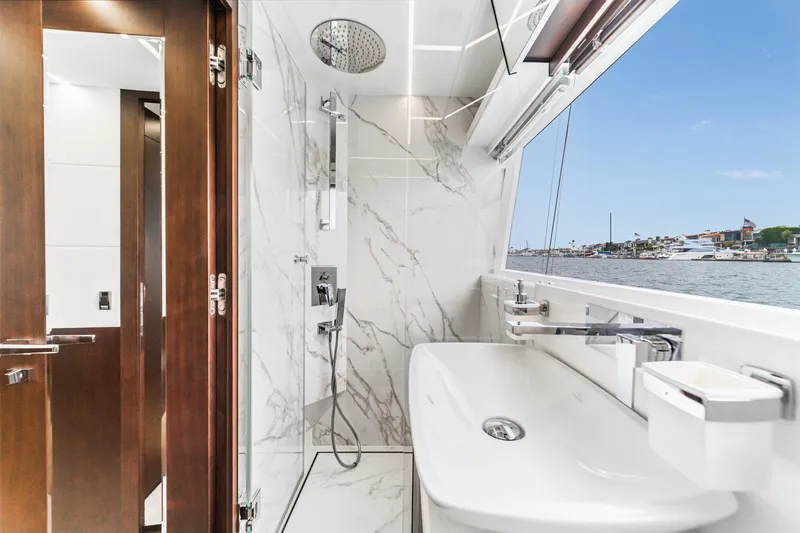 Slide: The Image of Luxurious bathroom on 2023 Galeon 640 Fly yacht with marble accents and waterfront view. - 43