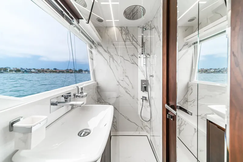 Slide: The Image of Luxurious bathroom on 2023 Galeon 640 Fly yacht with marble design and ocean view. - 46