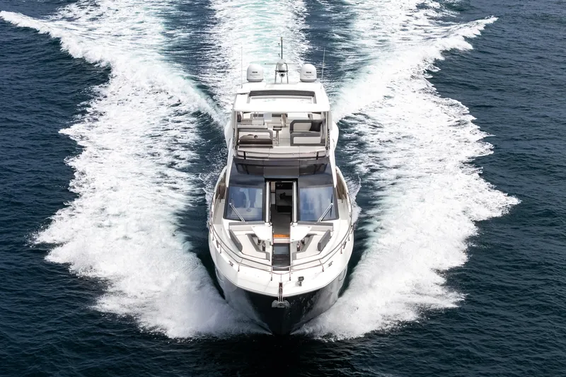 Slide: The Image of 2023 Galeon 640 Fly yacht cruising on open water, aerial view. - 53