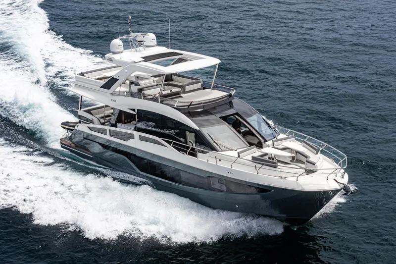 Slide: The Image of 2023 Galeon 640 Fly yacht cruising on open water, showcasing sleek design and luxury features. - 55