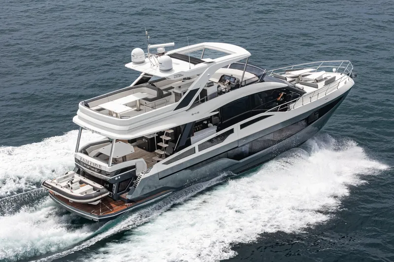 Slide: The Image of 2023 Galeon 640 Fly yacht cruising on open water, showcasing luxury design. - 56