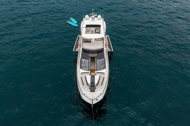 Slide: The Image of 2023 Galeon 640 Fly yacht on open water, aerial view. - 77