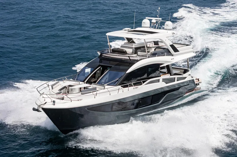Slide: The Image of 2023 Galeon 640 Fly yacht cruising on open water, showcasing sleek design and luxury features. - 8