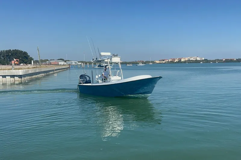 The Image of 1974 Aquasport 2400 Center Console boat cruising on calm waters. - 0
