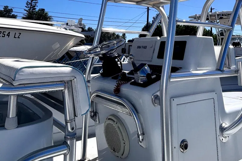 Slide: The Image of 1974 Aquasport 2400 Center Console boat interior with steering wheel and controls. - 10