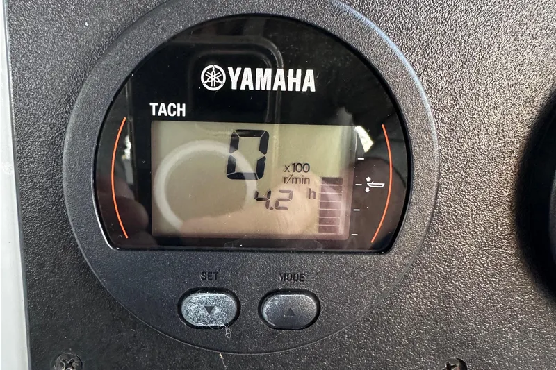 Slide: The Image of Yamaha tachometer display on 1974 Aquasport 2400 Center Console boat, showing 4.2 hours. - 12