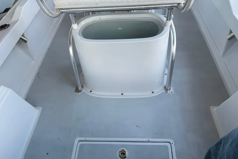 Slide: The Image of 1974 Aquasport 2400 Center Console interior with seating and storage area. - 13