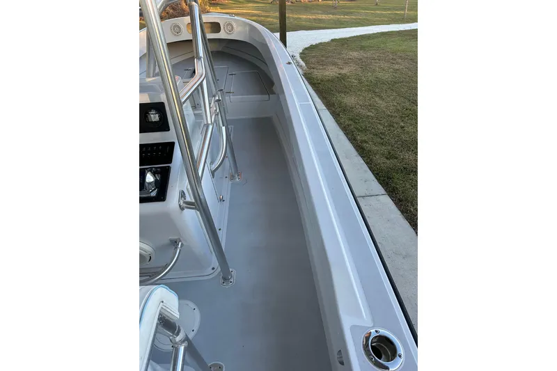 Slide: The Image of 1974 Aquasport 2400 Center Console boat interior with sleek design and stainless steel railings. - 15