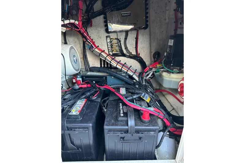 Slide: The Image of 1974 Aquasport 2400 Center Console boat electrical system with batteries and wiring. - 16