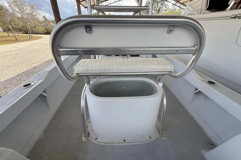 Slide: The Image of 1974 Aquasport 2400 Center Console interior with seating and storage. - 18