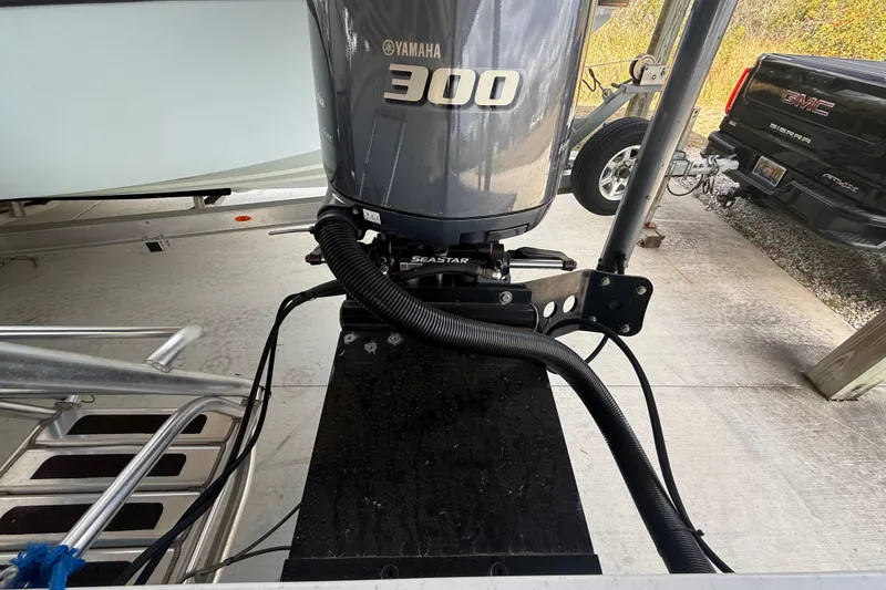 Slide: The Image of 1974 Aquasport 2400 Center Console with Yamaha 300 outboard engine in a garage. - 21