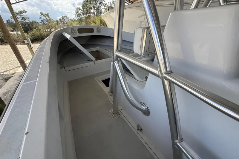Slide: The Image of 1974 Aquasport 2400 Center Console boat interior with open storage compartments. - 26