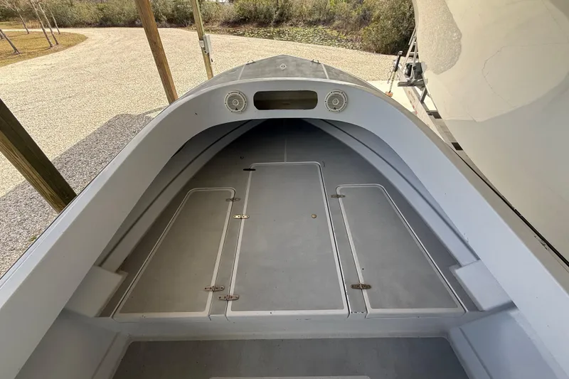 Slide: The Image of 1974 Aquasport 2400 Center Console boat interior with storage compartments. - 27