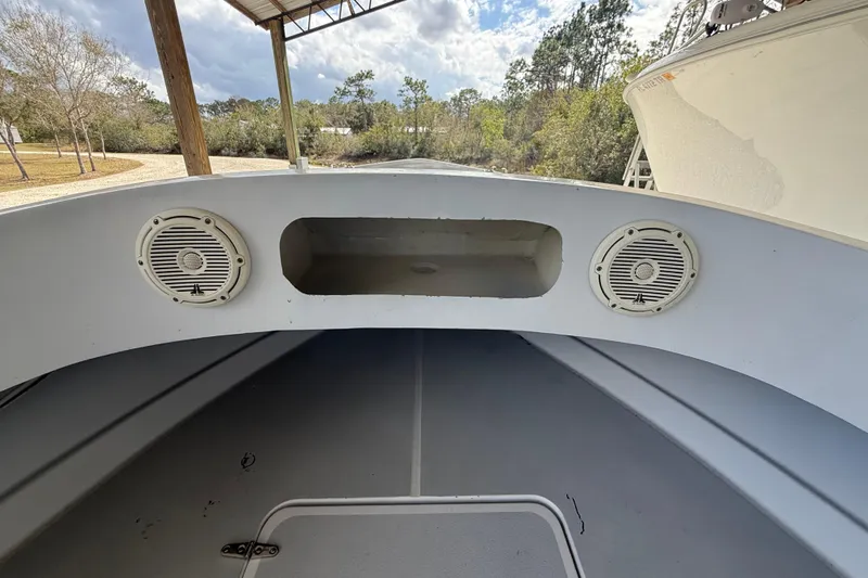 Slide: The Image of 1974 Aquasport 2400 Center Console boat interior with speakers and storage compartment. - 28