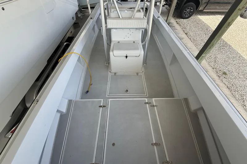 Slide: The Image of 1974 Aquasport 2400 Center Console boat interior with clean deck and storage compartments. - 30
