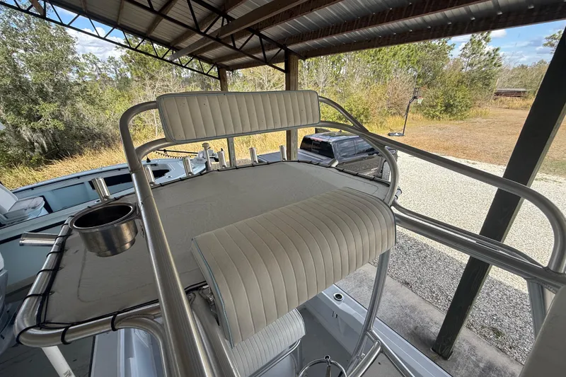 Slide: The Image of 1974 Aquasport 2400 Center Console boat with elevated seating under a metal canopy. - 34