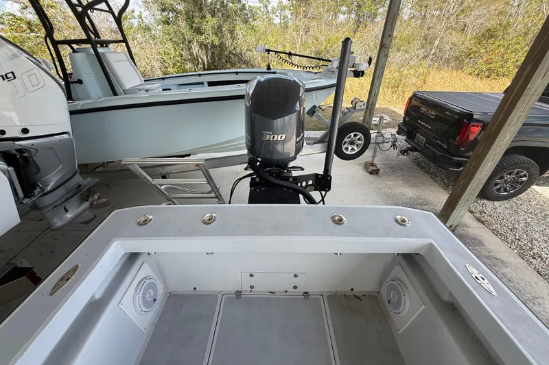 Slide: The Image of 1974 Aquasport 2400 Center Console boat with Yamaha 300 engine in a covered area. - 40