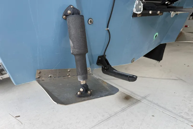 Slide: The Image of 1974 Aquasport 2400 Center Console boat trim tab and actuator detail. - 42