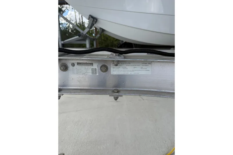 Slide: The Image of 1974 Aquasport 2400 Center Console boat on trailer, close-up of identification plate. - 48