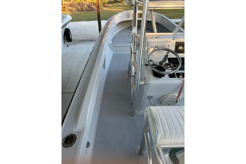 Slide: The Image of 1974 Aquasport 2400 Center Console boat interior with steering wheel and seating. - 9
