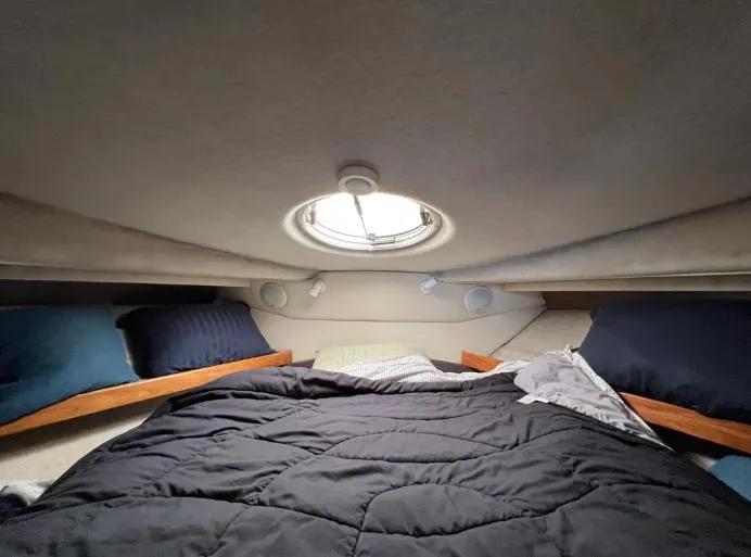 Slide: The Image of Cozy cabin interior of 1997 Bayliner 3788 Command Bridge Motoryacht with bed and porthole. - 25