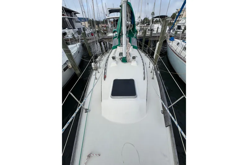 Slide: The Image of 1983 Sabre 34 sailboat docked at marina, view of deck and rigging. - 12
