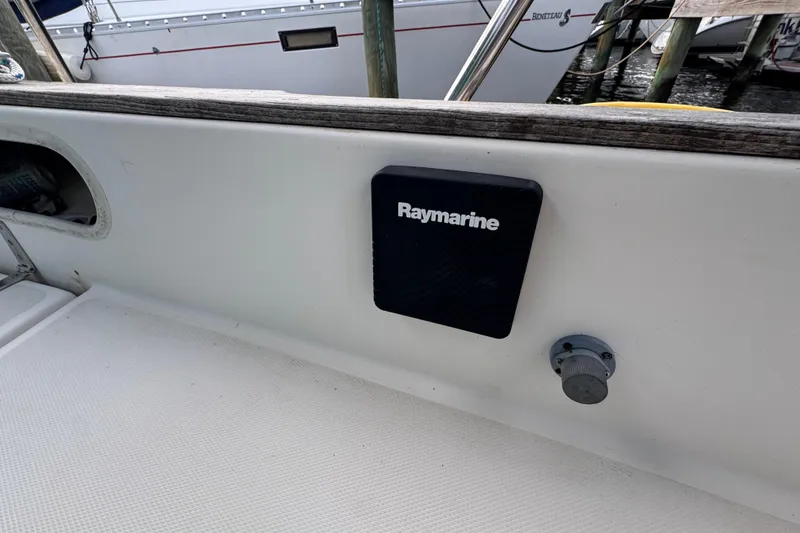 Slide: The Image of 1983 Sabre 34 sailboat cockpit with Raymarine equipment, docked at marina. - 17