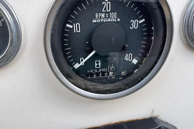 Slide: The Image of Close-up of a 1983 Sabre 34 tachometer, showing RPM and hour meter. - 20