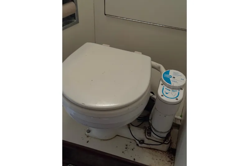Slide: The Image of 1983 Sabre 34 marine toilet with manual pump system. - 30