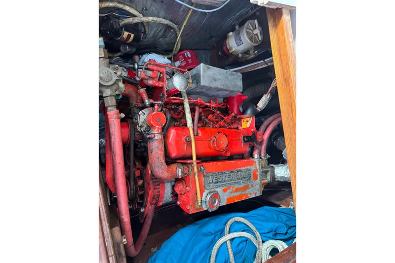 Slide: The Image of Engine compartment of a 1983 Sabre 34 sailboat with red Westerbeke engine. - 36