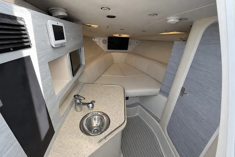 Slide: The Image of 2008 Hydra-Sports Vector 3500 VX cabin interior with seating, sink, and modern amenities. - 12