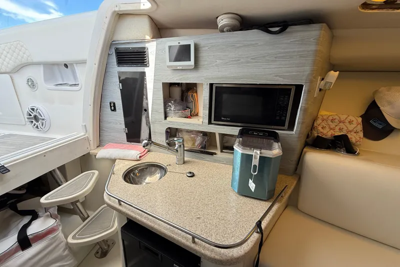 Slide: The Image of 2008 Hydra-Sports Vector 3500 VX cabin with kitchenette, sink, and microwave. - 14