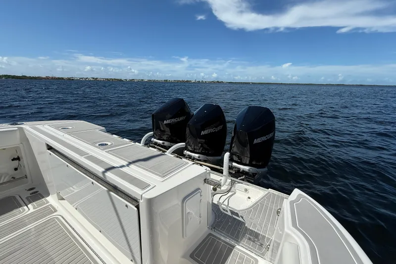 Slide: The Image of 2008 Hydra-Sports Vector 3500 VX boat with triple Mercury engines on open water. - 19