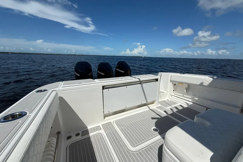 Slide: The Image of 2008 Hydra-Sports Vector 3500 VX boat deck with triple Mercury engines on open water. - 20