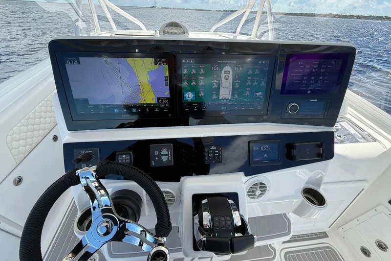 Slide: The Image of 2008 Hydra-Sports Vector 3500 VX dashboard with advanced navigation and control systems. - 22