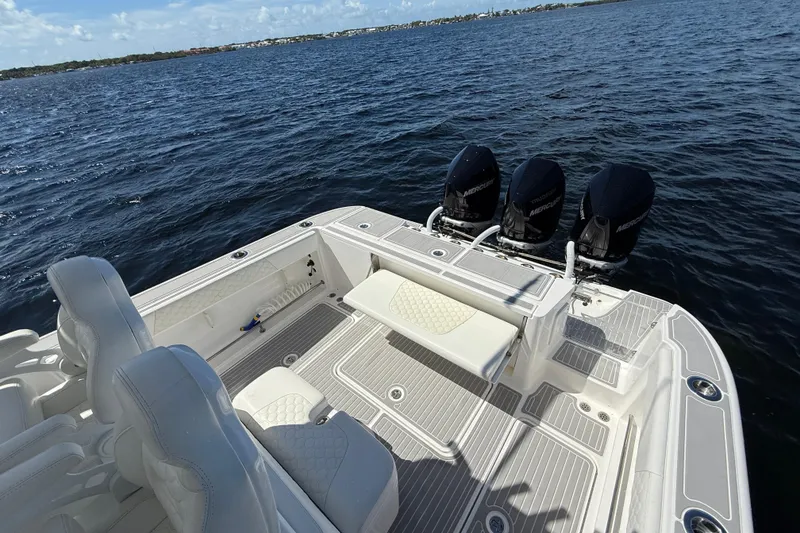 Slide: The Image of 2008 Hydra-Sports Vector 3500 VX boat with triple Mercury engines on open water. - 24