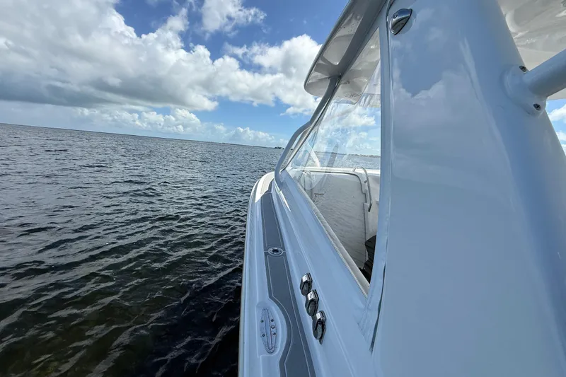 Slide: The Image of 2008 Hydra-Sports Vector 3500 VX cruising on open water under a blue sky. - 26