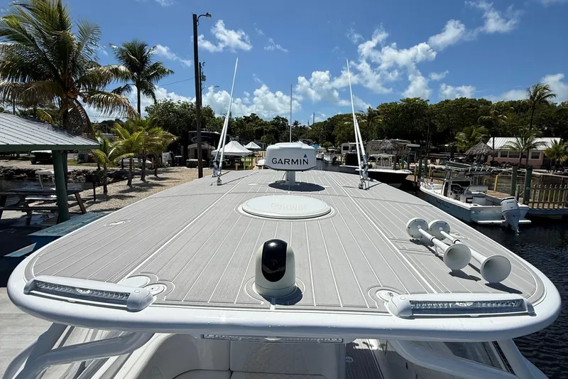 Slide: The Image of 2008 Hydra-Sports Vector 3500 VX boat docked, featuring Garmin equipment, under a clear blue sky. - 30