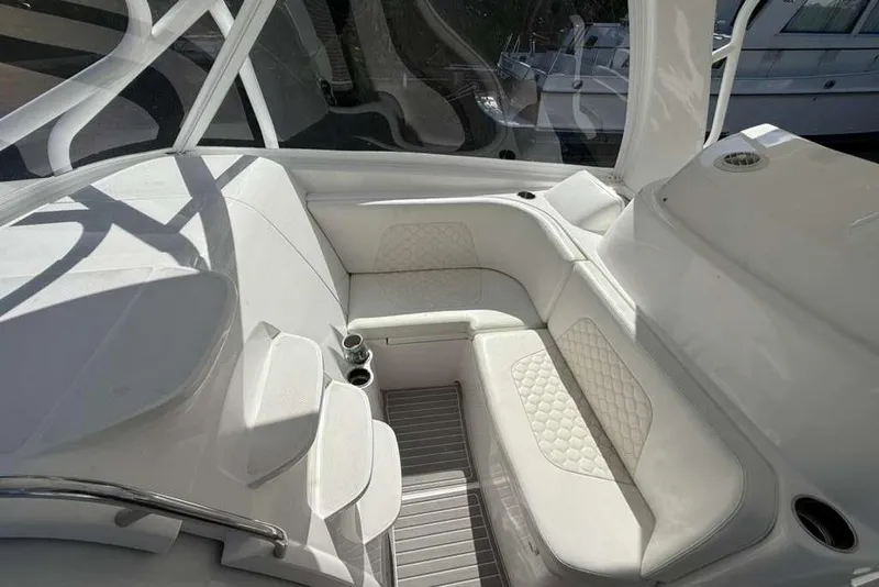 Slide: The Image of 2008 Hydra-Sports Vector 3500 VX boat interior with white cushioned seating. - 31