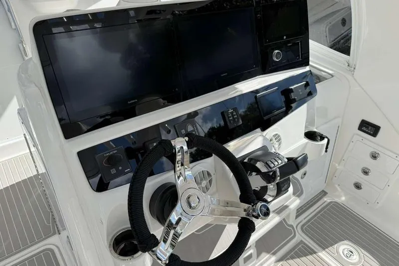 Slide: The Image of 2008 Hydra-Sports Vector 3500 VX helm with modern controls and navigation screens. - 36