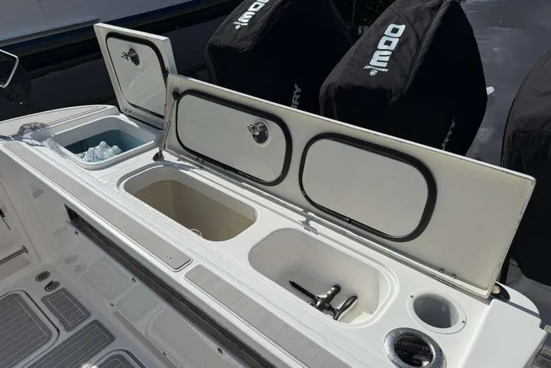 Slide: The Image of 2008 Hydra-Sports Vector 3500 VX boat storage compartments and engine covers. - 38