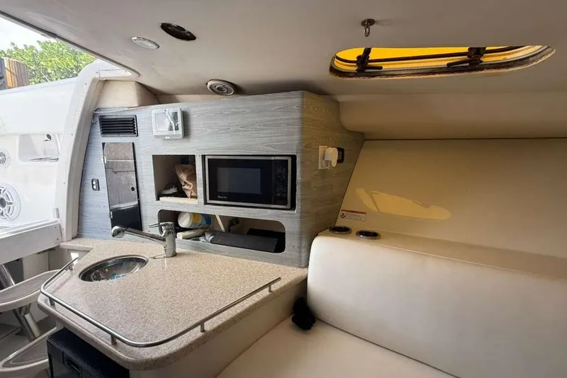 Slide: The Image of 2008 Hydra-Sports Vector 3500 VX cabin interior with kitchenette and seating area. - 43