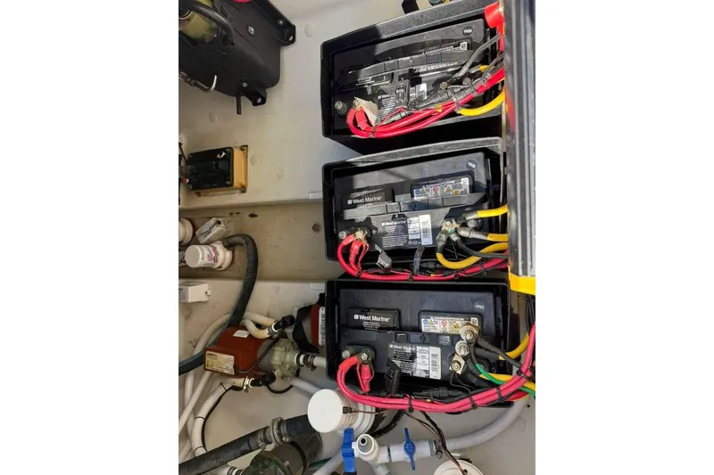 Slide: The Image of 2008 Hydra-Sports Vector 3500 VX boat battery compartment with West Marine batteries and wiring. - 44