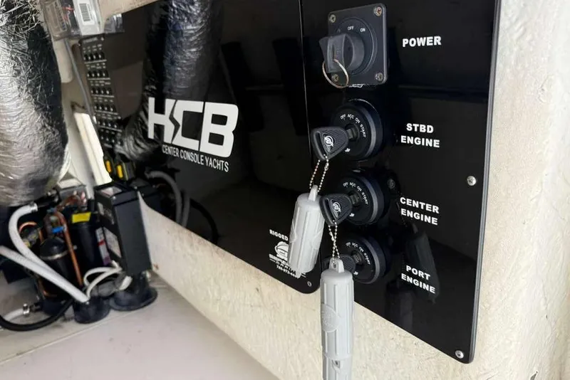 Slide: The Image of Control panel of a 2008 Hydra-Sports Vector 3500 VX boat with engine switches. - 46